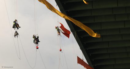 Greenpeace activists hang from a bridge in Houston